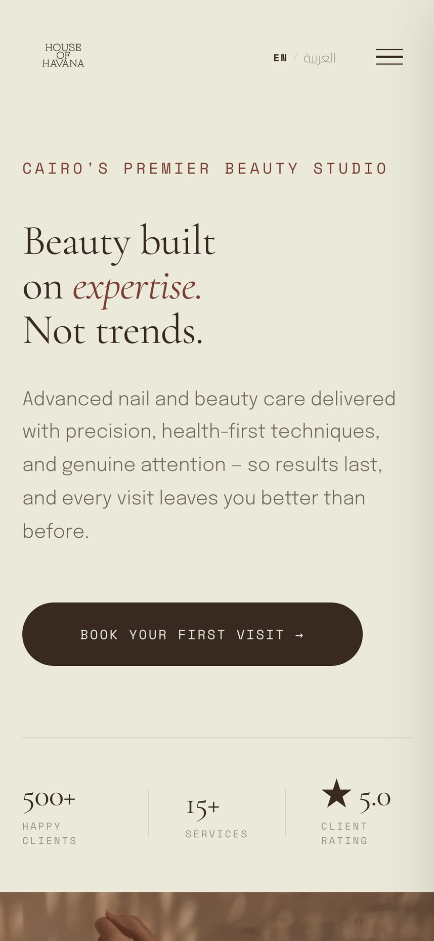 The House of Havana site on a phone: the headline, the Book Your First Visit button and the language switch, all in a single stacked column.